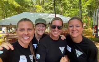 13 Lady Blue & Gold volunteers smiling